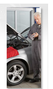 mechanic wiping hands after inspecting an engine