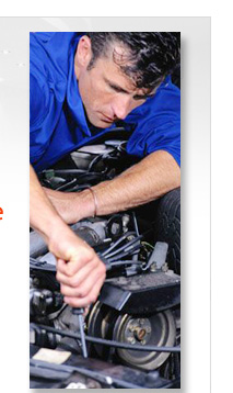 Mechanic inspecting car engine